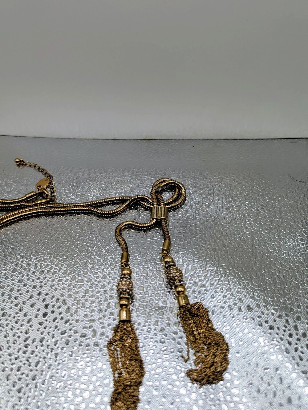 Gold Tone Lariet Necklace With Tassels And White Stones